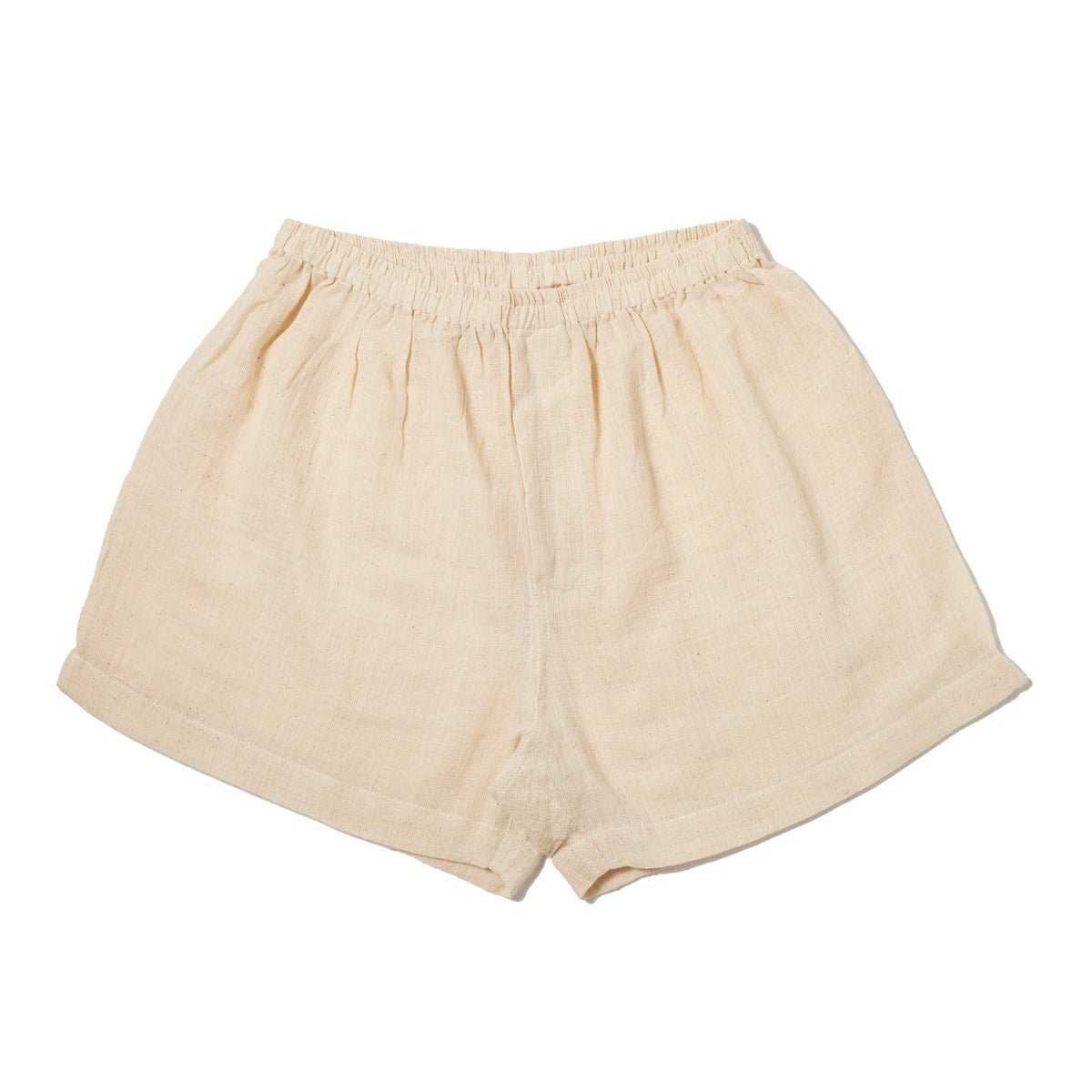 A pair of kids' organic cotton handloom boxers, beige in color, with elastic waistband.