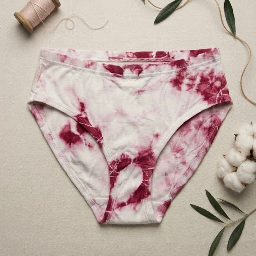 Tie-dye underwear with cotton and thread on a neutral background